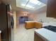 Bright kitchen featuring stainless steel appliances, tile flooring, and sliding glass doors to the backyard at 7641 Tortola Bay Ln, Las Vegas, NV 89128