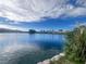 Scenic view of the lake featuring calm waters and lush shoreline vegetation at 7641 Tortola Bay Ln, Las Vegas, NV 89128