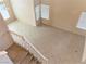 Bright living room showcasing tile flooring, generous natural light, and neutral walls offering an open feel at 7641 Tortola Bay Ln, Las Vegas, NV 89128