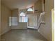 Inviting living room showcasing an open floor plan, tile floors, and staircase at 7641 Tortola Bay Ln, Las Vegas, NV 89128