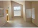 Bright living room featuring vaulted ceiling, tile flooring and lots of natural light at 7641 Tortola Bay Ln, Las Vegas, NV 89128