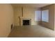 Living room showcasing a fireplace, tile flooring, and natural light, all in neutral tones at 7641 Tortola Bay Ln, Las Vegas, NV 89128