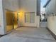 Patio featuring a sliding glass door, window, concrete pad, and metal gate, providing easy outdoor access at 7641 Tortola Bay Ln, Las Vegas, NV 89128