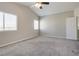 Spacious carpeted bedroom with light walls and natural light at 7816 Calico Flower Ave, Las Vegas, NV 89128