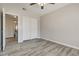 This bedroom features sleek hardwood floors and a double door closet for storage at 7816 Calico Flower Ave, Las Vegas, NV 89128