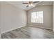 Neutral bedroom offers sleek hardwood floors and a large window to let in natural light at 7816 Calico Flower Ave, Las Vegas, NV 89128