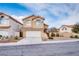 Charming two-story home featuring a tile roof, stucco exterior, desert landscaping, and a two car garage at 7816 Calico Flower Ave, Las Vegas, NV 89128