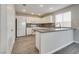 Modern kitchen with white cabinets, stainless steel appliances, and gray countertops at 7816 Calico Flower Ave, Las Vegas, NV 89128