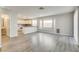 Open concept living space with kitchen, breakfast bar, and view to bathroom at 7816 Calico Flower Ave, Las Vegas, NV 89128