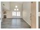 Bright living room features a fireplace, vaulted ceilings, and large windows for lots of natural light at 7816 Calico Flower Ave, Las Vegas, NV 89128