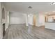 Open floor plan featuring wood flooring, fireplace and views to the kitchen at 7816 Calico Flower Ave, Las Vegas, NV 89128