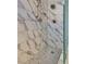 Stylish shower features elegant marble tile, rainfall shower head, and unique mosaic tile floor at 7816 Calico Flower Ave, Las Vegas, NV 89128