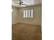 Neutral bedroom featuring carpet flooring, shuttered windows, and a ceiling fan at 8756 Shady Pines Dr, Las Vegas, NV 89143