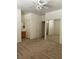 Cozy bedroom with carpet flooring, ceiling fan, and a mirrored closet at 8756 Shady Pines Dr, Las Vegas, NV 89143