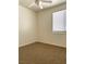 This is a basic bedroom with neutral colors, including a ceiling fan and window with blinds at 8756 Shady Pines Dr, Las Vegas, NV 89143