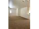 Inviting living room features neutral paint, carpet, and lots of natural light at 8756 Shady Pines Dr, Las Vegas, NV 89143