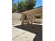 Covered patio with concrete base, pillars, and a view of the yard and surrounding trees at 8756 Shady Pines Dr, Las Vegas, NV 89143