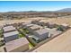 This aerial view shows rooftops in a planned community, showcasing location near desert preserve at 9054 Tangerine Tree Ct, Las Vegas, NV 89113