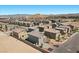 This is an aerial shot of multiple properties in a developed neighborhood against mountains at 9054 Tangerine Tree Ct, Las Vegas, NV 89113