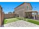 A charming backyard with a putting green, patio, and a covered seating area at 9054 Tangerine Tree Ct, Las Vegas, NV 89113