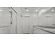 Beautiful bathroom with a double vanity, shower, and clean, modern finishes throughout at 9054 Tangerine Tree Ct, Las Vegas, NV 89113