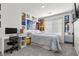 A cheerful bedroom featuring a desk, bed, and decorated walls at 9054 Tangerine Tree Ct, Las Vegas, NV 89113