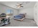 Well-lit bedroom with a neutral color palette and large windows overlooking the neighborhood at 9054 Tangerine Tree Ct, Las Vegas, NV 89113