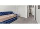 A bedroom featuring plush carpeting, a blue daybed, and closet space at 9054 Tangerine Tree Ct, Las Vegas, NV 89113