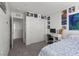 This is a bedroom view featuring a bed, desk, and decorations on the wall at 9054 Tangerine Tree Ct, Las Vegas, NV 89113