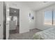 A simple bedroom featuring neutral walls and carpet and an open doorway at 9054 Tangerine Tree Ct, Las Vegas, NV 89113