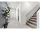 Welcoming foyer featuring stylish tile flooring, a staircase, and modern decor at 9054 Tangerine Tree Ct, Las Vegas, NV 89113