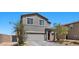 Attractive two-story house boasts a gray facade, complemented by a landscaped front yard at 9054 Tangerine Tree Ct, Las Vegas, NV 89113