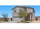 Charming two-story home features a well-manicured lawn and a neutral color scheme at 9054 Tangerine Tree Ct, Las Vegas, NV 89113