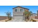 Beautiful two-story residence with a gray exterior and low-maintenance desert landscaping at 9054 Tangerine Tree Ct, Las Vegas, NV 89113