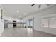 Open kitchen featuring stainless steel appliances and tile flooring throughout the home at 9054 Tangerine Tree Ct, Las Vegas, NV 89113