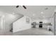 Bright kitchen with white cabinets, stainless steel appliances, and open floor plan at 9054 Tangerine Tree Ct, Las Vegas, NV 89113