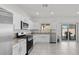 Stylish kitchen featuring stainless steel appliances and a sliding door to the backyard at 9054 Tangerine Tree Ct, Las Vegas, NV 89113