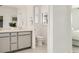Bright and well-organized bathroom with double sinks and separate toilet room at 9351 Aria Ridge Ave, Las Vegas, NV 89143