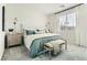 Comfortable bedroom featuring stylish furniture, bedside tables, and an eye-catching accent wall at 9351 Aria Ridge Ave, Las Vegas, NV 89143