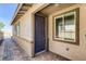 Close up of front door featuring a craftsman style door and stone walkway at 9351 Aria Ridge Ave, Las Vegas, NV 89143