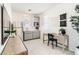 Office area with desk, chair, mini fridge, and mounted television at 9351 Aria Ridge Ave, Las Vegas, NV 89143