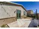 Outdoor patio with a sliding glass door leading to a covered wooden deck at 9351 Aria Ridge Ave, Las Vegas, NV 89143
