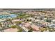 Overhead view of a neighborhood, highlighting solar panels, backyard pools, and proximity to community amenities at 9410 Stone Castle Way, Las Vegas, NV 89123