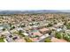 Elevated view of a residential community, spotlighting attractive homes and backyard swimming pools at 9410 Stone Castle Way, Las Vegas, NV 89123