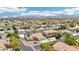 Expansive aerial view of a vibrant residential neighborhood with well-maintained homes and mountain views at 9410 Stone Castle Way, Las Vegas, NV 89123