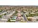 Panoramic aerial view of a suburban neighborhood featuring houses with pools and solar panels at 9410 Stone Castle Way, Las Vegas, NV 89123