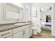 Bathroom featuring a granite vanity with gold fixtures, and a bedroom view at 9410 Stone Castle Way, Las Vegas, NV 89123