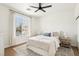 Cozy bedroom with natural light, carpet, and stylish decor at 9410 Stone Castle Way, Las Vegas, NV 89123