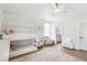 Bedroom with a bunkbed with slide, hardwood floor, and a view into bathroom at 9410 Stone Castle Way, Las Vegas, NV 89123