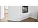 A corner fireplace is set into the wall with white molding in this bright home at 9410 Stone Castle Way, Las Vegas, NV 89123